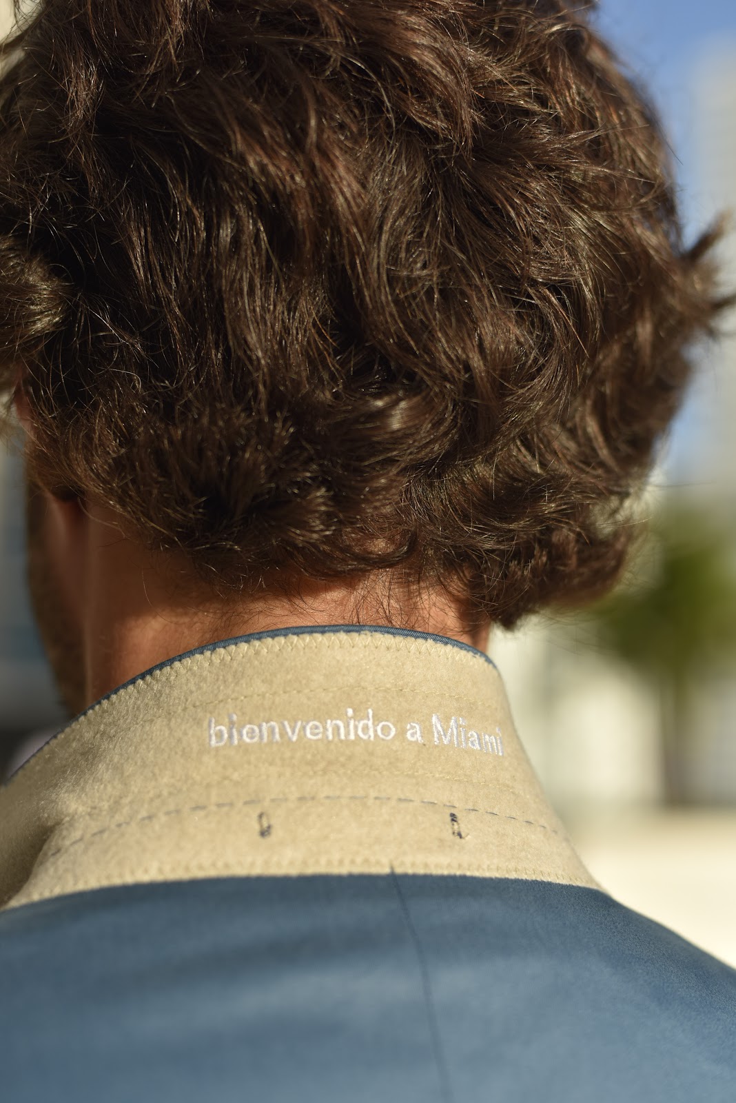 Custom embroidered collar detail showcasing personalized touches available in bespoke tailoring